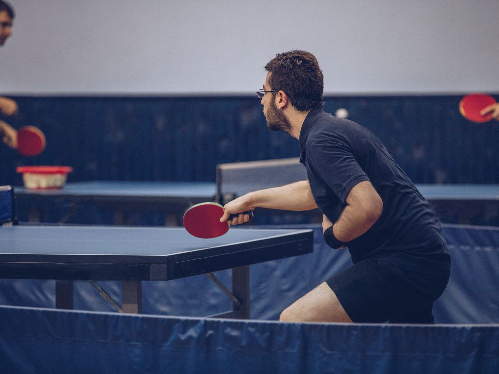 can your bat touch the table in table tennis